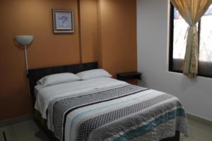 Postel nebo postele na pokoji v ubytování JULIUS Hostal