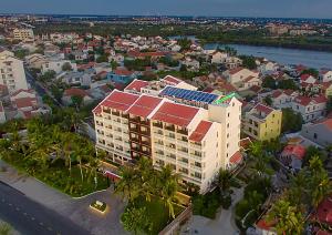 an aerial view of a building in a city at Wyndham Garden Hoi An Cua Dai Beach in Hoi An
