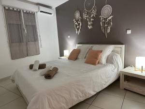 Voodi või voodid majutusasutuse Appartement Ti Vaniy, T3, Anse Mitan, Trois ilets, Martinique toas