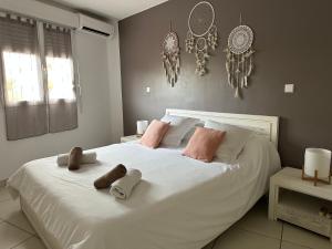 Voodi või voodid majutusasutuse Appartement Ti Vaniy, T3, Anse Mitan, Trois ilets, Martinique toas