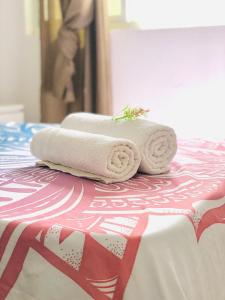 two towels sitting on top of a bed at Happy Place, Boa Vista, Salrei in Sal Rei