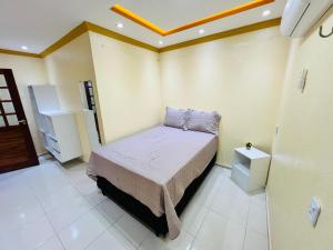 Llit o llits en una habitació de Suítes Rancho Pesqueiro