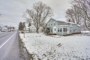 a house sitting on the side of a road in the snow at Chic New Hartford Apartment - Hike, Golf and Ski! in New Hartford