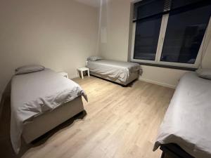 En eller flere senge i et værelse på Apartment in Brussels City with Beautiful View