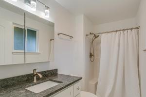 a bathroom with a sink and a toilet and a shower at Modern Puyallup Townhome with Backyard and Fireplace in Puyallup +16 photos