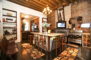 a kitchen with a table and chairs and a stove at Fleur De Lis Mansion in New Orleans