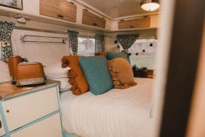 a bedroom with a bed in an rv at Splitters Farm in Sharon