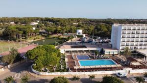 an aerial view of a hotel with a pool at Alua Illa de Menorca in S'Algar