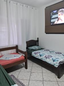 Hostel do Enzo tesisinde bir odada yatak veya yataklar