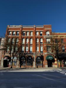 a large brick building on a city street at The Met Hotel in New Westminster