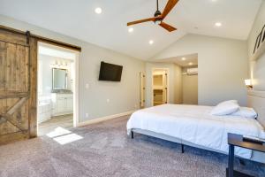 Schlafzimmer mit einem Bett und einer Schiebetür in der Unterkunft Spacious Stillwater Home with Yard and Fire Pit! in Stillwater