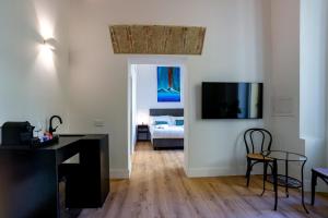 TV a/nebo společenská místnost v ubytování Rolando Domus