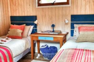 Ein Bett oder Betten in einem Zimmer der Unterkunft Casa Malalcahuello Corralco