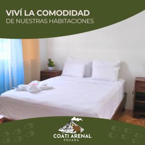 a poster of a bed in a hotel room at coati del arenal posada in Fortuna