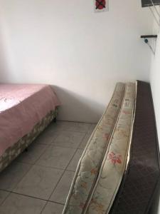 En eller flere senge i et værelse på 5 Minutos da Praia de Itapema
