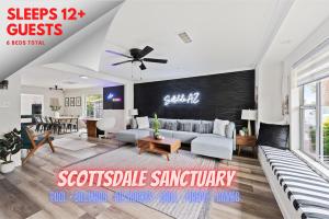 a living room with a couch and a ceiling fan at Scottsdale Sanctuary Luxury Coveted Retreat in Scottsdale