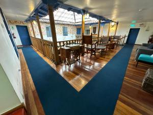 an overhead view of a room with tables and chairs at Posada Villa Mayor in Cusco