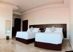 Postel nebo postele na pokoji v ubytování Hotel Zócalo Chilpancingo