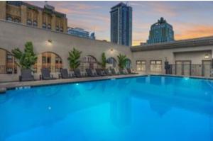 a large swimming pool in the middle of a building at 2 Bedroom Apartment Downtown LA! in Los Angeles