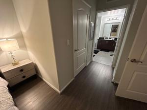 a bedroom with a bed and a hallway with a door at 2 Bedroom Apartment Downtown LA! in Los Angeles