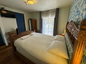Cama ou camas em um quarto em Posada Villa Mayor