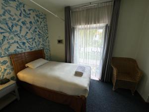 Cama ou camas em um quarto em Posada Villa Mayor