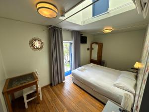 Cama ou camas em um quarto em Posada Villa Mayor