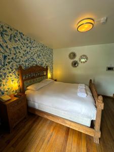 Cama ou camas em um quarto em Posada Villa Mayor