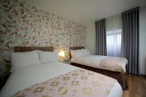 Cama ou camas em um quarto em Posada Villa Mayor