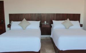 Postel nebo postele na pokoji v ubytování Hotel Zócalo Chilpancingo