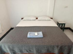 Postel nebo postele na pokoji v ubytování bulan homestay