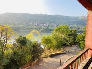a view of a river from a balcony at Lake View Lavish studio in Lavasa