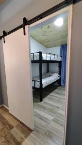 a door leading into a room with bunk beds at Casa Charlotte in San José +27 photos