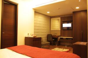 Voodi või voodid majutusasutuse The Nanee Suites toas