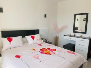 a bedroom with a bed with hearts on it at The Rooftop - Amazing apartment - Sea view - Pool - Penthouse -Jacuzzi - Sharm el Sheikh in Sharm El Sheikh +36 photos