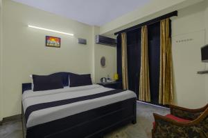 Voodi või voodid majutusasutuse Hotel O Malhotra BnB toas
