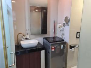 a bathroom with a sink and a mirror at KL Q520 Premium Suite Room in Kuala Lumpur
