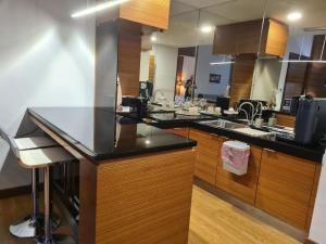 a kitchen with a counter top and a sink at KL Q520 Premium Suite Room in Kuala Lumpur