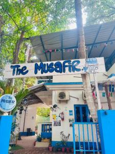 a sign in front of a building that says the mixtape at THE MUSAFIR HOSTEL in Anjuna