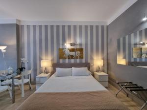 Postel nebo postele na pokoji v ubytování B&B Pescara Centro Luxury Suite