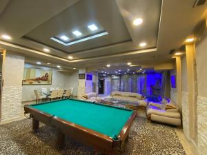 a living room with a pool table in it at SpaHotel in Yerevan