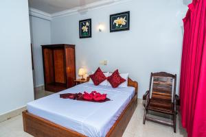 Postel nebo postele na pokoji v ubytování Golden Papaya Guesthouse
