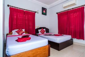 Postel nebo postele na pokoji v ubytování Golden Papaya Guesthouse