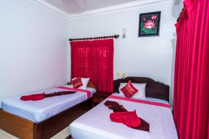 Postel nebo postele na pokoji v ubytování Golden Papaya Guesthouse