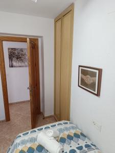 Posteľ alebo postele v izbe v ubytovaní Apartamento Velázquez