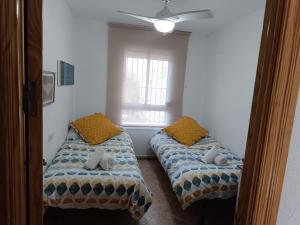 Posteľ alebo postele v izbe v ubytovaní Apartamento Velázquez