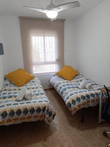 Posteľ alebo postele v izbe v ubytovaní Apartamento Velázquez