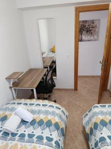 Posteľ alebo postele v izbe v ubytovaní Apartamento Velázquez