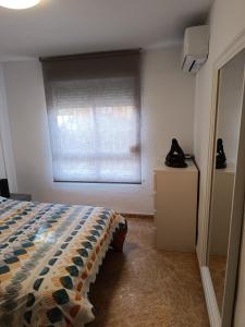 Posteľ alebo postele v izbe v ubytovaní Apartamento Velázquez