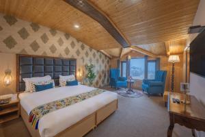 Krevet ili kreveti u jedinici u okviru objekta Echor Kashmir Holidays Resort Srinagar